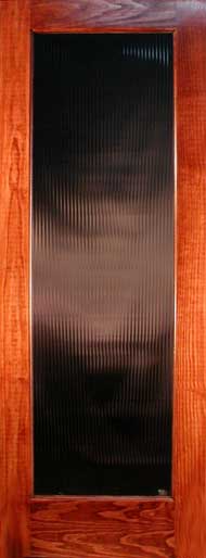 Stained pine door with reeded glass for interior use. 